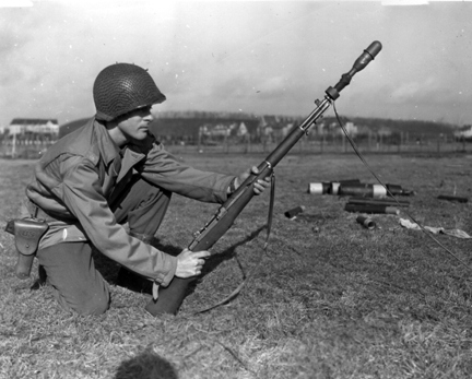 American soldier in a training session of rifle grenade launch. Blank grenade fitted in a M1 Garand rifle with the Rifle Grenade Launcher, M7.