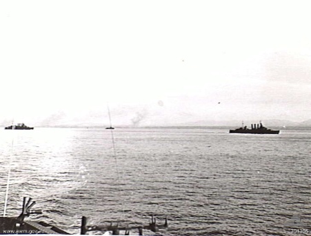 Australian heavy cruisers HMAS Shropshire (left) and HMAS Australia (right) bombarding Morotai