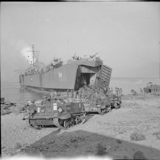 British Army in Italy 1943 Universal carriers drive ashore from a tank landing ship (LST) at Salerno, 8 September 1943.