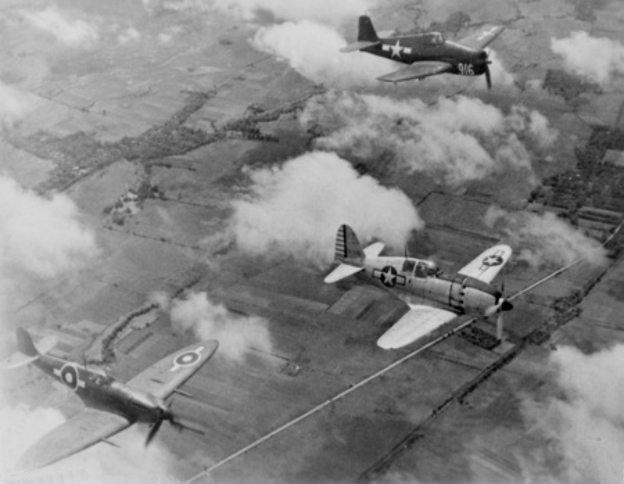 Over the Philippines, a formation of aircraft led by a captured Japanese Navy interceptor fighter aircraft Mitsubishi J2M Raiden (Thunderbolt, allied code name “Jack”), of the Technical Air Intelligence Unit, South West Pacific Area