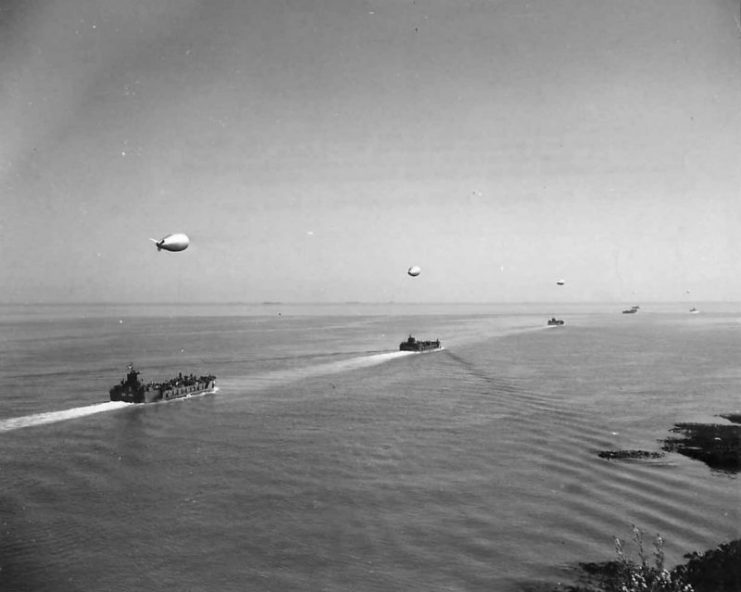 A convoy of LCTs and barrage balloons preparing for the D-Day Invasion