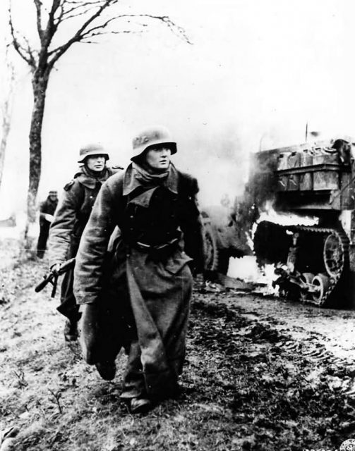 German Troops by a burning US M3 Halftrack Battle of the Bulge