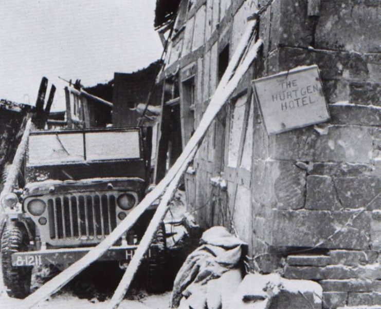 A farmhouse on the main route through Hürtgen served as a shelter for HQ Company, 121st Infantry Regiment, 8th Infantry Division, XIX Corps, 9th US Army, as indicated on the bumper of the jeep. They nicknamed it the “Hürtgen Hotel”.