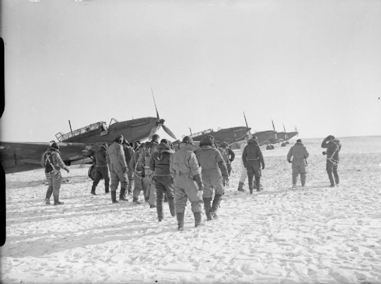 Royal Air Force- France, Fairey Battle aircrew walk to their aircraft on a snow-covered airfield.