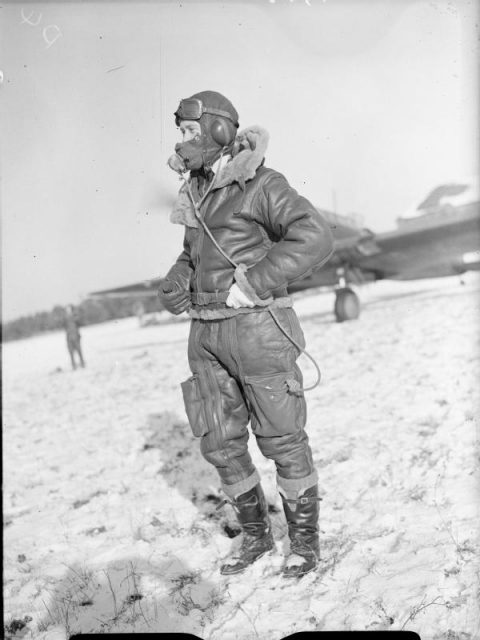 Royal Air Force- France, 1939-1940 The pilot of a Fairey Battle, wearing a Type B helmet and Irvin flying suit on a snow covered airfield in France