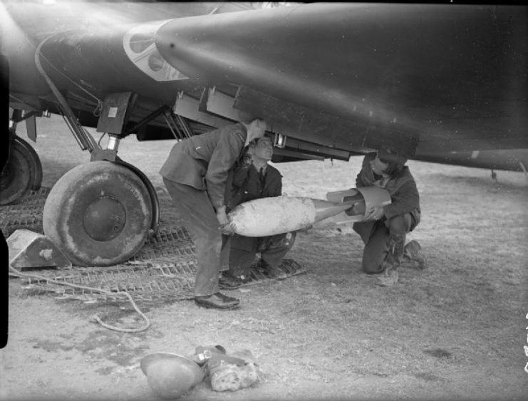 Royal Air Force- France, 1939-1940. Armorers load a 250-lb GP bomb into the outboard port wing-cell of a Fairey Battle of No. 103 Squadron RAF at Betheniville.