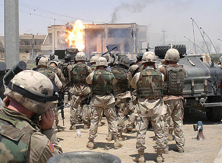 Flame erupts from a building hit with a TOW missile launched by soldiers of the Army’s 101st Airborne Division (Air Assault) on July 22 in Mosul, Iraq. Saddam Hussein’s sons Qusay and Uday were killed in the battle as they resisted efforts by coalition forces to apprehend and detain them.