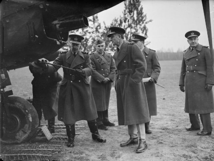 Photograph of Air Chief Marshal Sir Cyril Newall inspecting a Fairey Battle aircraft in France. Air Commodore Lord Londonderry is looking on whilst Air Vice-Marshal Patrick Playfair, the Commander of the Advanced Air Striking Force, is to be seen on the right.