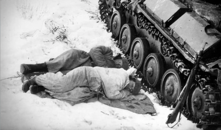 Tank crew sleep near their T-70