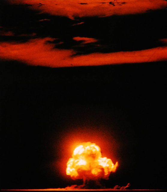 July 16, 1945, Civilian worker at Los Alamos lab, working under the aegis of the Manhattan Project.”Famous color photograph of the “Trinity” shot, the first nuclear test explosion”.