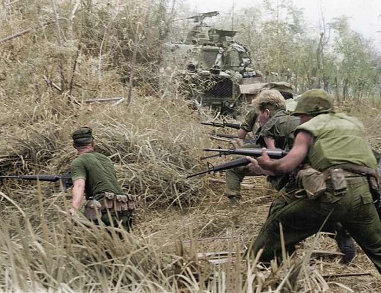 U.S. Marines with Company G, 2d Battalion, 7th Marines, direct a concentration of fire at the enemy during Operation Allen Brook