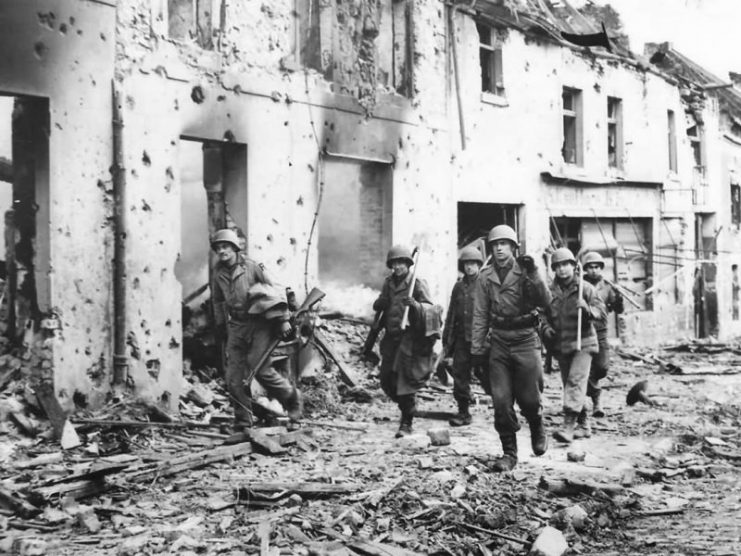 US Soldiers Advance through the streets of Weisweiler Germany 1944