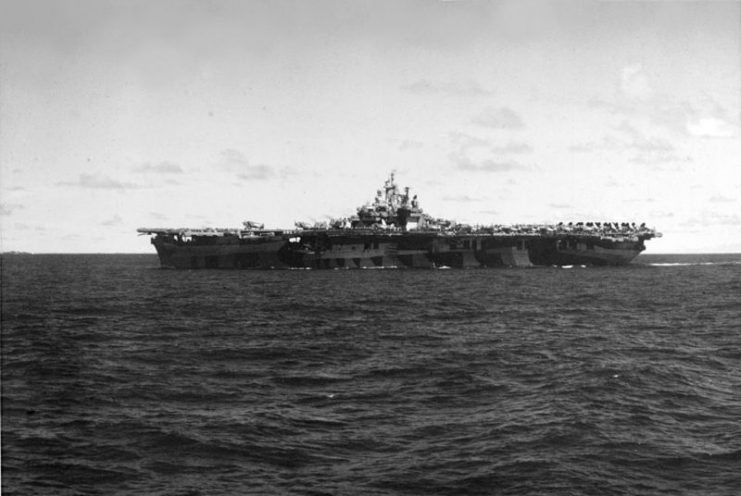 USS Bunker Hill (CV-17) at sea while participating in strikes on the Palau Islands, 27 Mar 1944.
