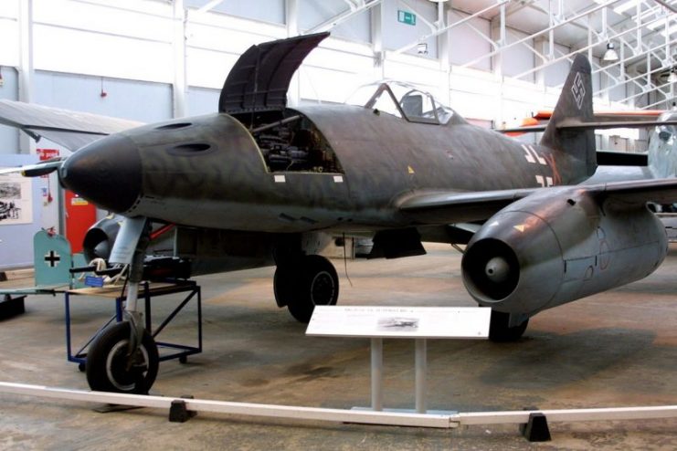 Me 262 A-1a on display at RAF Cosford. Some A-1a aircraft (including this example), like the A-2a bomber variant, attached additional hardpoints for extra weapons near the ejector chutes of the cannons, such as a bomb rack under each side of the nose.Photo by Paul Maritz CC BY-SA 3.0