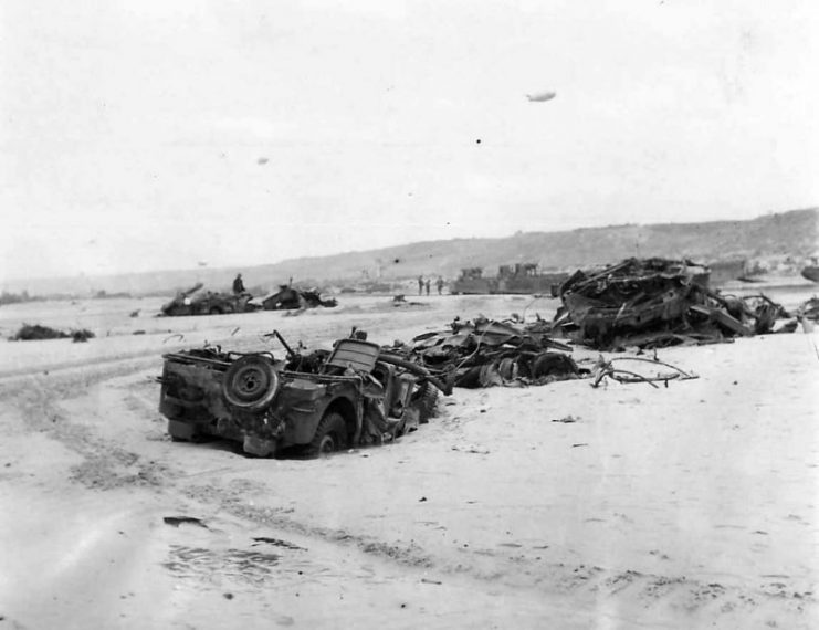 The wreckage of Jeeps and Armored Vehicles on D-Day Beachhead 1944