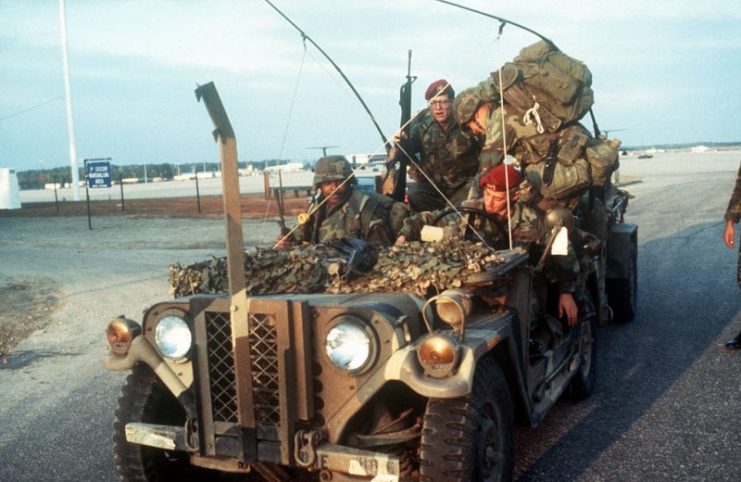 Soldiers of the 82nd Airborne Division in a heavily loaded M151 during Operation Urgent Fury