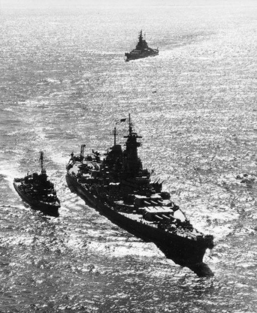 USS Missouri leading USS Iowa into Tokyo Bay, Japan, 30 August 1945. Note destroyer USS Nicholas in escort.