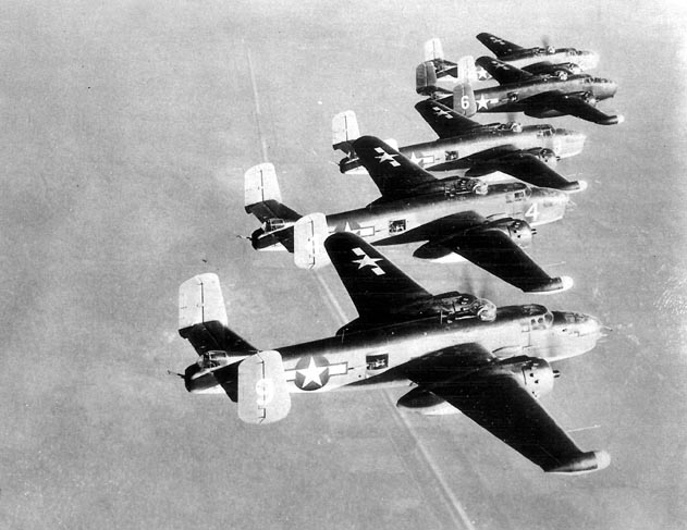 Five PBJ-1J Mitchells of Marine Squadron VMB-614 in a training flight over an undisclosed location in the US, 1944-1945. Note radomes on starboard wingtips.