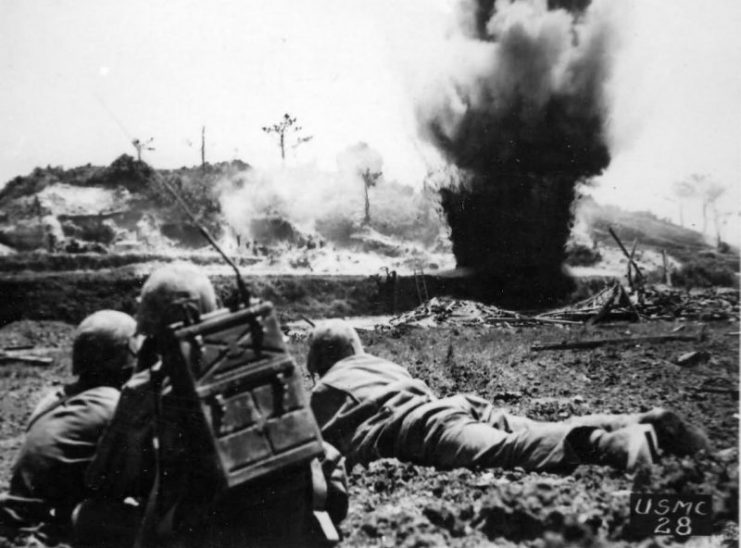 6th Marine Division blasts Japanese Position on Okinawa, Pacific war.