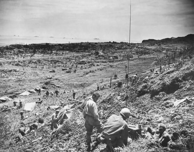 7th Infantry Division soldiers of the US 10th Army swarm into Yonabaru on the coast of Okinawa