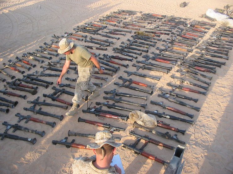 U.S. Marines inventory a large number of weapons stockpiled by the Muqtada Militia in An Najaf, Iraq, on Sept. 3, 2004.