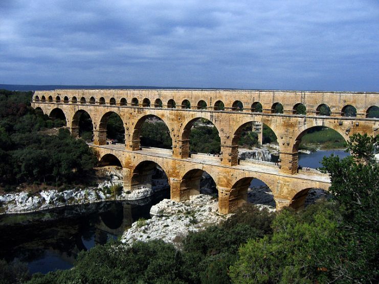 The multiple arches of the Pont du Gard in Roman Gaul (modern-day southern France). The upper tier encloses an aqueduct that carried water to Nimes in Roman times; its lower tier was expanded in the 1740s to carry a wide road across the river.Photo: Emanuele CC BY-SA 2.0