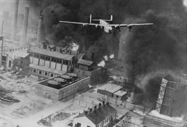 A B-24 flying over a burning oil refinery at Ploiesti, Romania. 1 August 1943