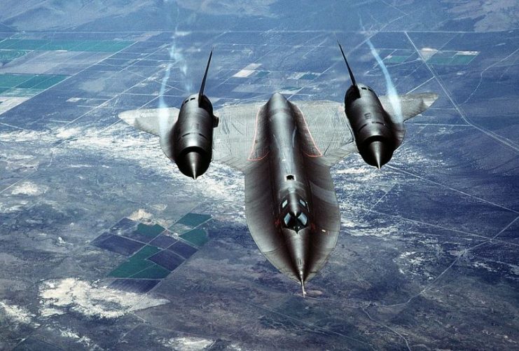 An air-to-air overhead front view of an SR-71A strategic reconnaissance aircraft. The SR-71 is unofficially known as the “Blackbird.”