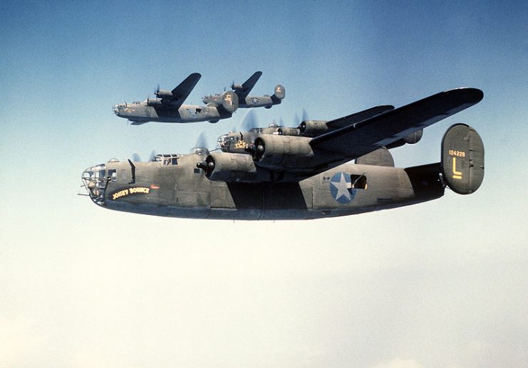 B-24Ds of 93rd Bomb Group in formation. Nearest aircraft is Joisey Bounce, wingman is The Duchess, and next higher is Bomerang.