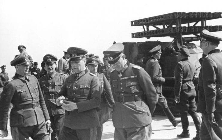 Inspecting 21st Panzer Division troops and a mule track carrier of the Nebelwerfer. By Bundesarchiv Bild CC-BY-SA 3.0