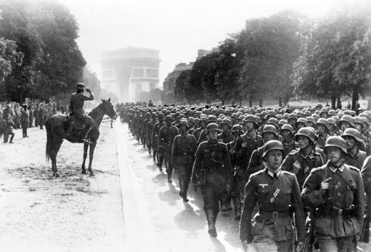 German soldiers march near the Arc de Triomphe in Paris, 14 June 1940. By Bundesarchiv Bild CC-BY-SA 3.0