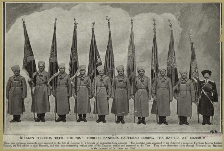 Russian soldiers (Don Cossacks) with the nine Ottoman banners captured during the battle at Erzerum.