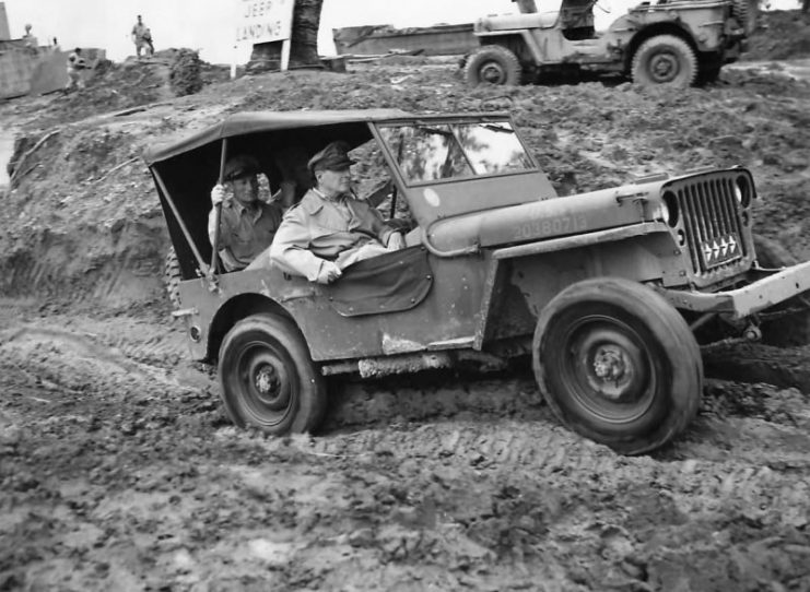 Gen MacArthur riding in Jeep at Jeep Landing on Leyte 1944.