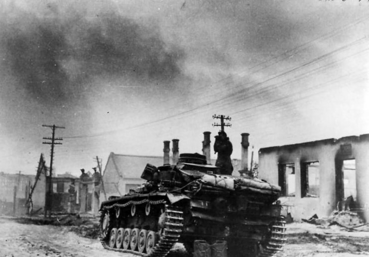 German tank officer atop Panzer III on outskirts of Wjasma 1941