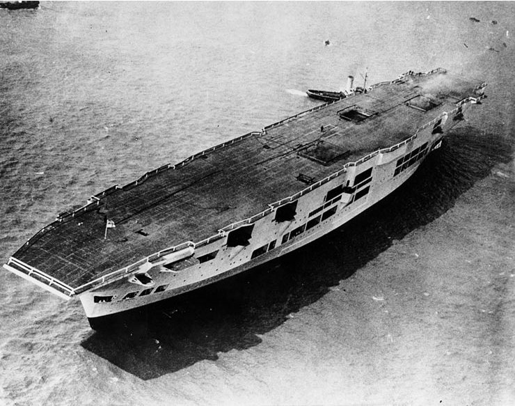 Ark Royal immediately after launching. The lifts on the flight deck and the anti-aircraft positions on the hull are visible.