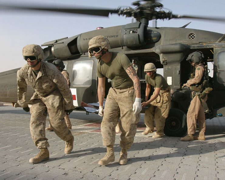 Marines Unloading Wounded in Iraq from Blackhawk Helicopter.