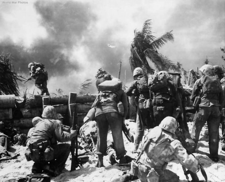 Marines storm Japanese held airport on Tarawa.