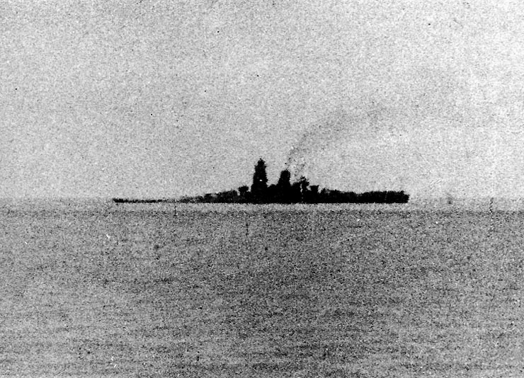 Musashi down by the bow after the air attacks, shortly before her sinking.