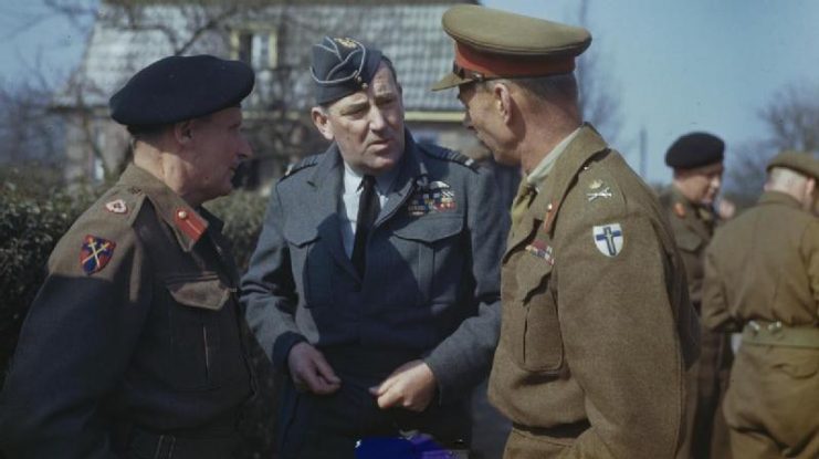 Montgomery (left), Air Marshal Sir Arthur Coningham (center) and the Commander of the British Second Army, Lieutenant General Sir Miles Dempsey, talking after a conference in which Montgomery gave the order for the Second Army to begin Operation Plunder.