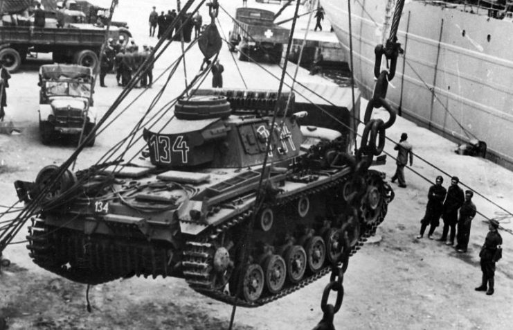 Panzer III 134 DAK tank being loaded into a ship