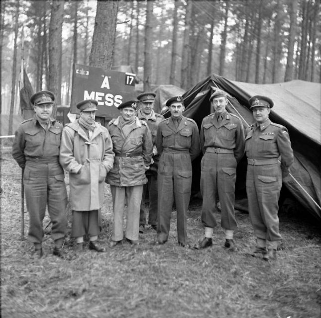Montgomery with officers of the First Canadian Army. From left, Major-General Vokes, General Crerar, Field Marshal Montgomery, Lieutenant-General Horrocks, Lieutenant-General Simonds, Major-General Spry, and Major-General Matthews.