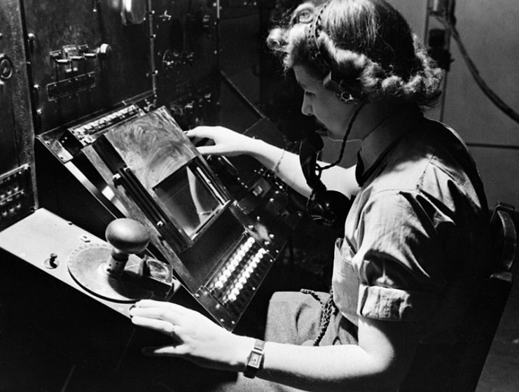 WAAF radar operator Denise Miley plotting aircraft on a cathode ray tube in the Receiver Room at Bawdsey ‘Chain Home’ station, May 1945.