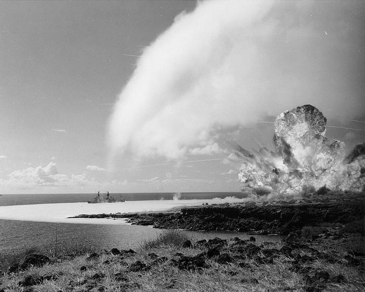 Detonation of the 500-ton TNT explosive charge as part of Operation Sailor Hat in 1965. The white blast-wave is visible on the water surface and a shock condensation cloud is visible overhead.