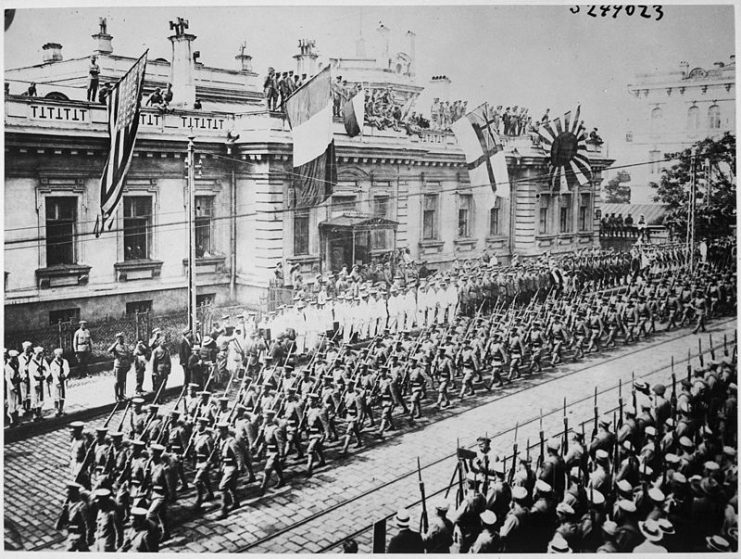 Vladivostok, Russia. Soldiers and sailors from many countries are lined up in front of the Allies Headquarters Building. The United States is represented.