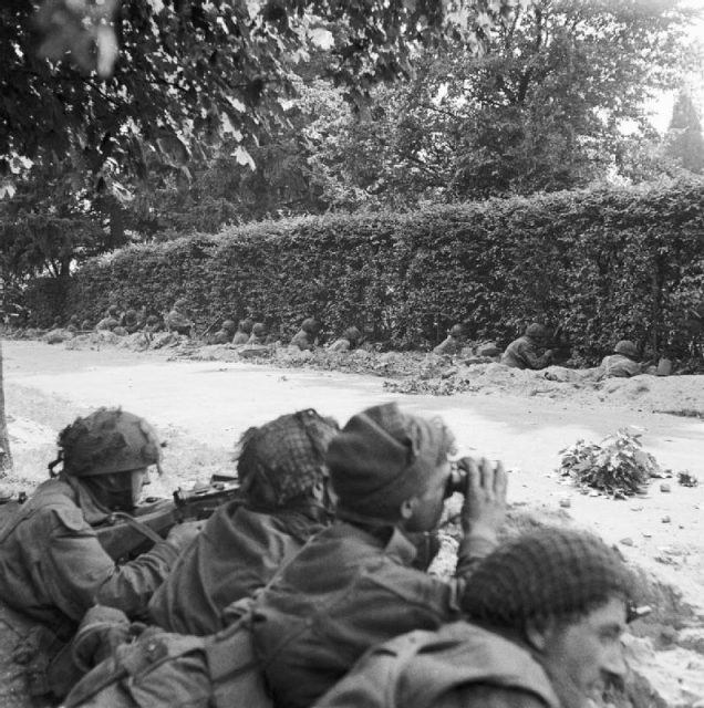 17 Sep 1944. Men of C Company 1st Battalion, Border Regiment, waiting in ditches beside the road, ready to repulse an attack by the enemy who were barely 100 yards away.