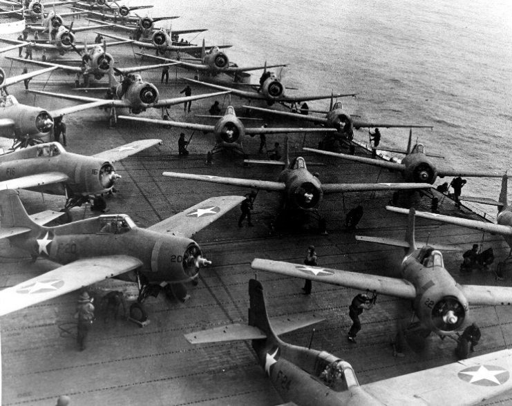 F4F-4 Wildcat fighters and SBD Dauntless dive bombers being prepared to launch from the flight deck of USS Hornet, off Midway, 4 June 1942.