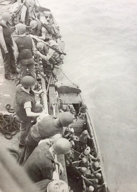 Captain Stevens’s men leaving the USS Henrico troop ship for their rendezvous with destiny. (Photo credit: USMC)
