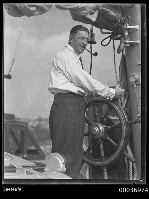 Count Felix Graf von Luckner at the wheel on board his two-masted schooner SEETEUFEL, 1938