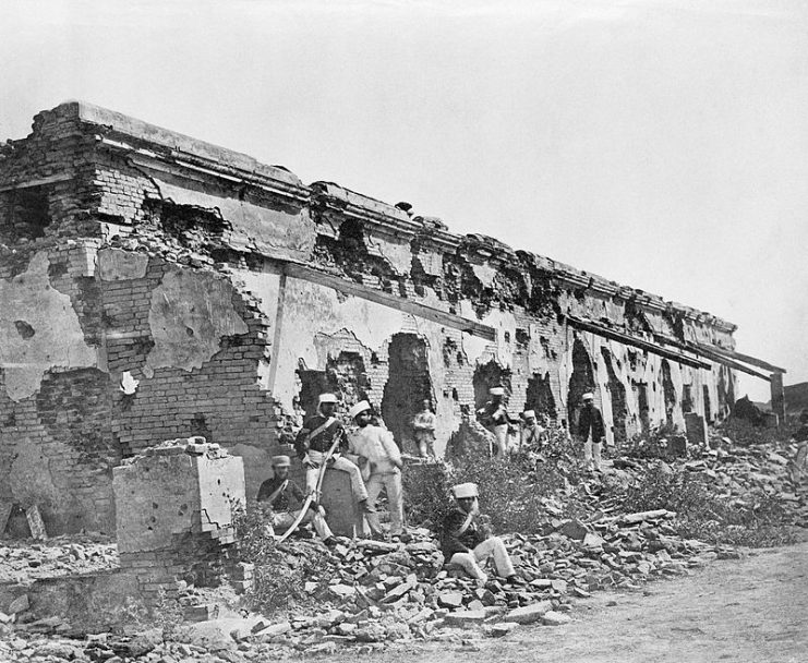 Aftermath of the Siege of Cawnpore. Soldiers of the 1st Madras Fusiliers seated amongst the remains of the British entrenchment de fences to barracks at Cawnpore which General Sir Hugh Massy Wheeler surrendered in June 1857.