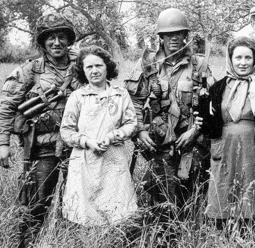 Forrest Guth and Floyd Talbert with locals on D-day morning